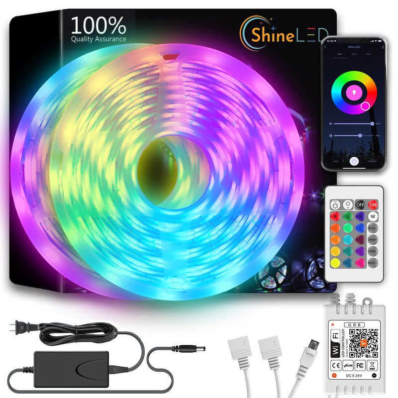 The Shine LED 32.8ft Smart WiFi RGB Strip Light boasts 300 color-changing LEDs that provide vibrant, multicolored illumination. The packaged set includes a remote control, smartphone app display, voice control feature, power adapter, various connectors, and the LED light strip coiled in a circular shape. The packaging proudly states "100% Quality Assurance.”